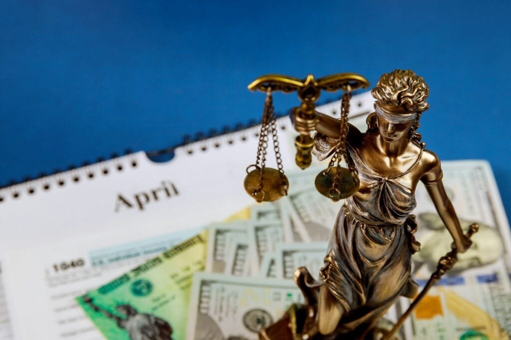 Law concept with statue of justice scale in many hundred dollars cash money and U